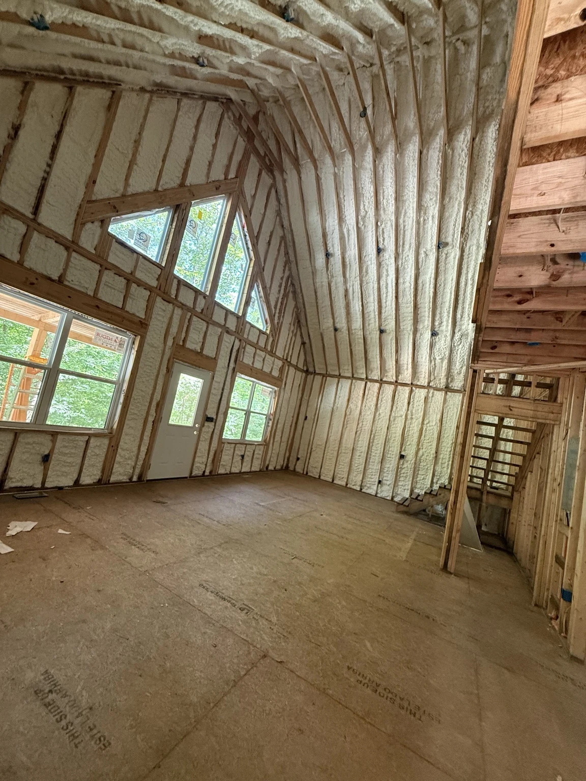 Optimus spray foam insulation installed throughout a vaulted room